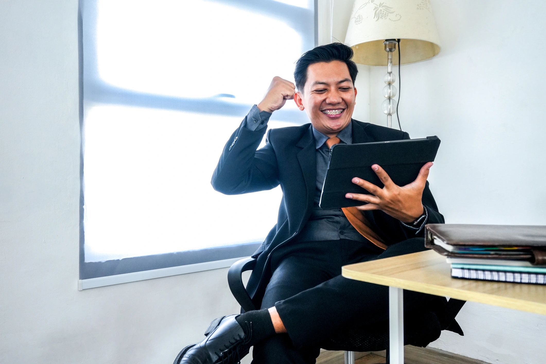 Business owner celebrating success at a home office